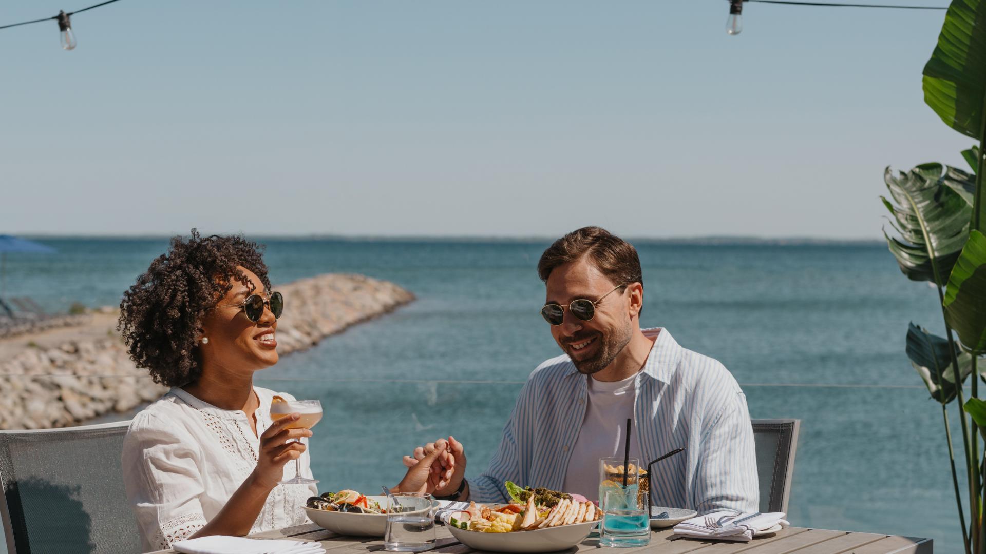 Couple enjoying a lakeside dinner in Innisfil, along the beautiful shores of Lake Simcoe