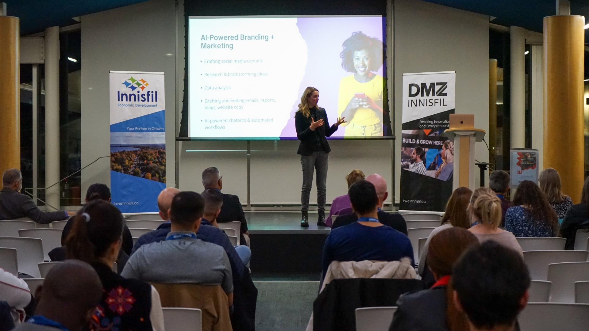 Emily Baillie, AI & Marketing Speaker speaking on stage at our Innisfil Business Showcase in 2024.