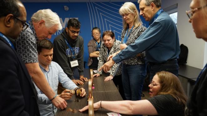 Group of DMZ Innisfil program participants interacting in a workshop at DMZ Innisfil Office
