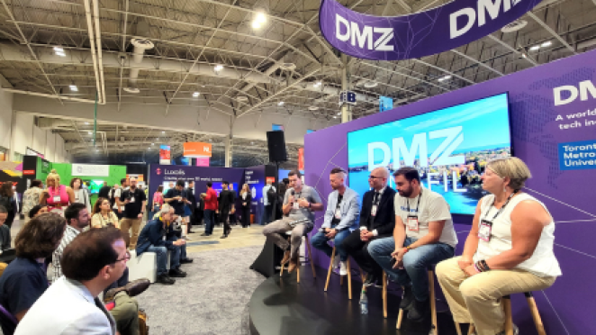 The innisfil DMZ group presenting as a panel at a conference in front of a purple backdrop