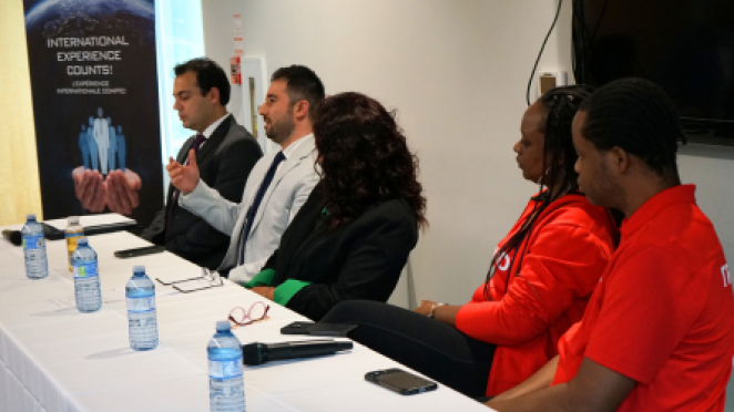 Panel of newcomer entrepreneurs giving a talk