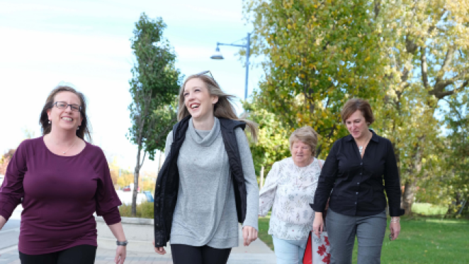 Group of women walking while chatting outside