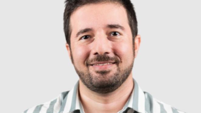 Morteza Gharaee, a man with brown hair and a beard wearing a white and green stripped button up shirt