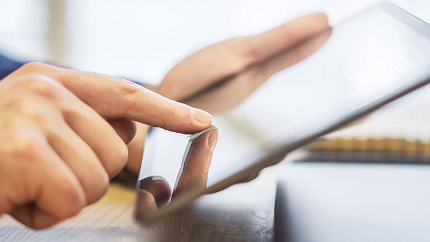 Person checking their emails on a tablet