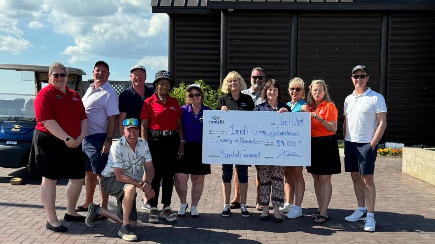 Innisfil Council presenting a check to Innisfil Foundation representatives at the Mayor's Golf Tournament
