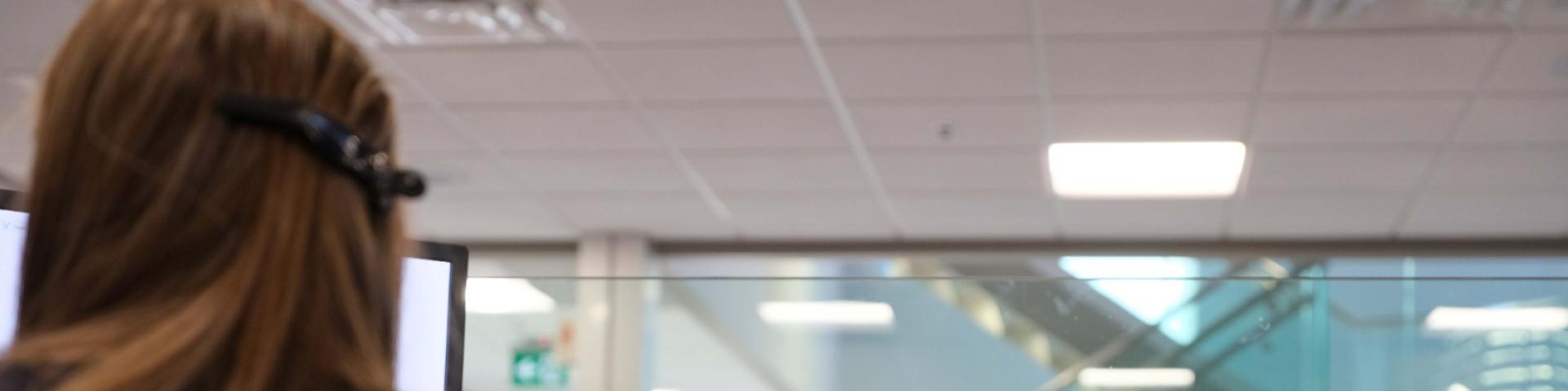 Person with a headset working in an office environment