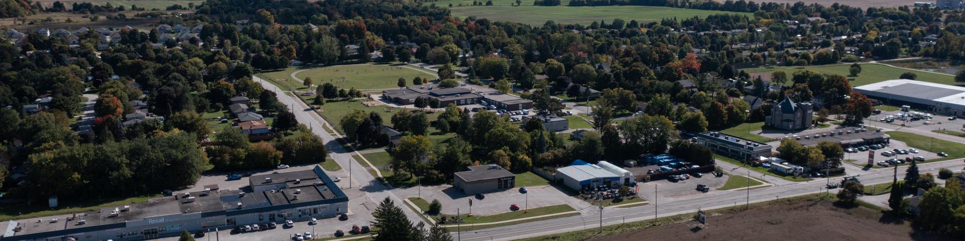 Aerial view of Yonge Street with lots of trees and buildings in the summer time