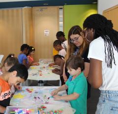 Children working on crafts at a table at the Innisfil ideaLAB & Library Lakeshore Branch
