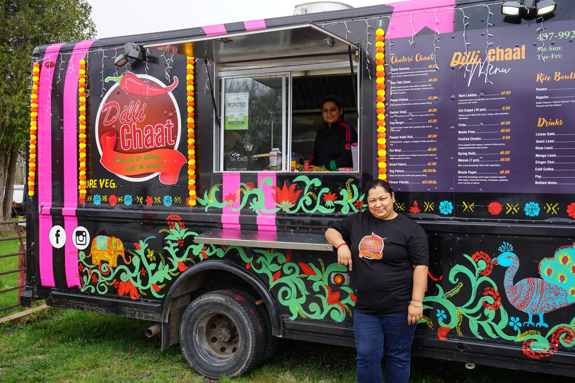 Woman standing in front of the Dilli Chaat food truck