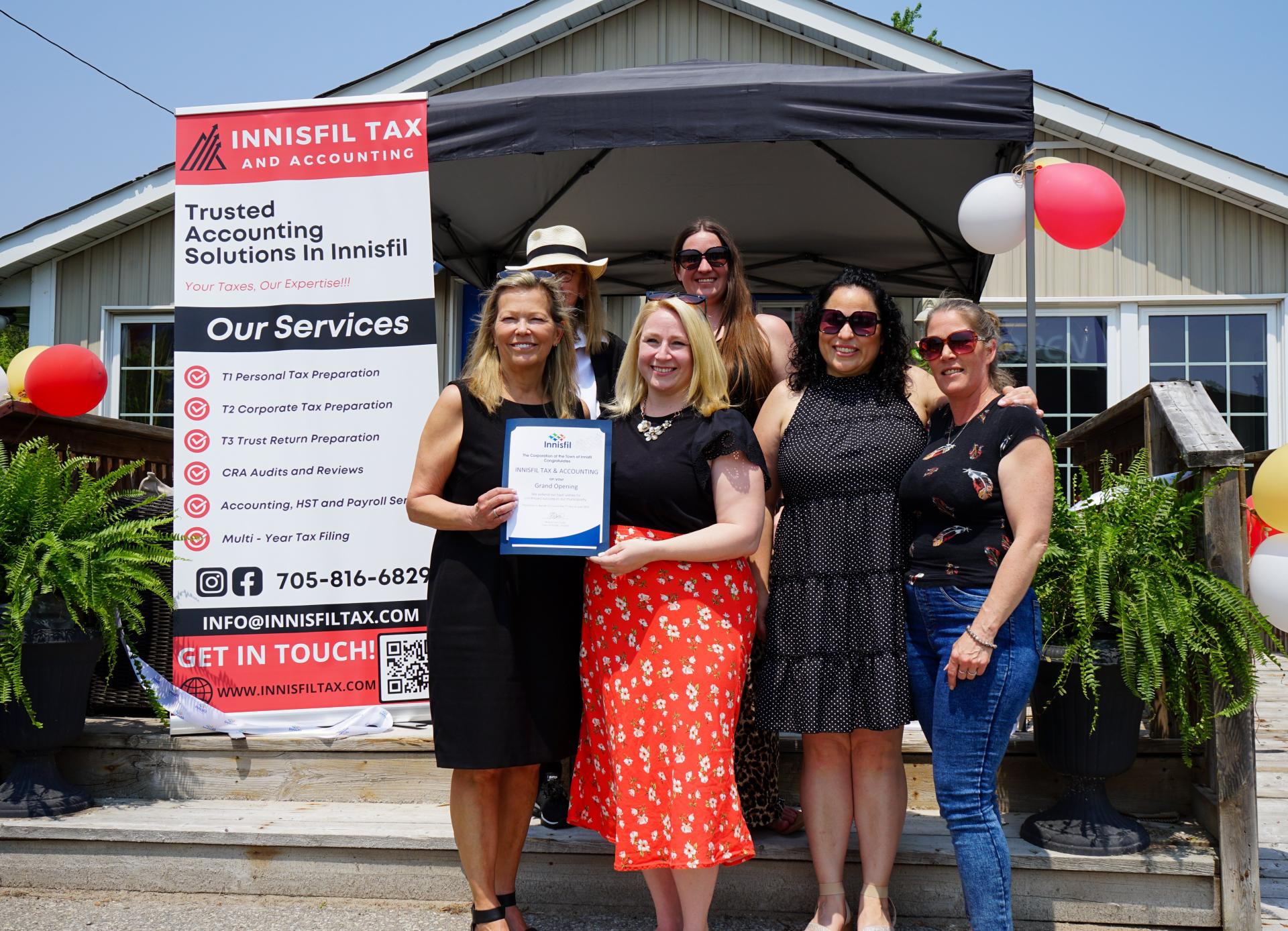 Mayor Dollin and staff of Innisfil Tax and Accounting celebrating the businesses grand opening
