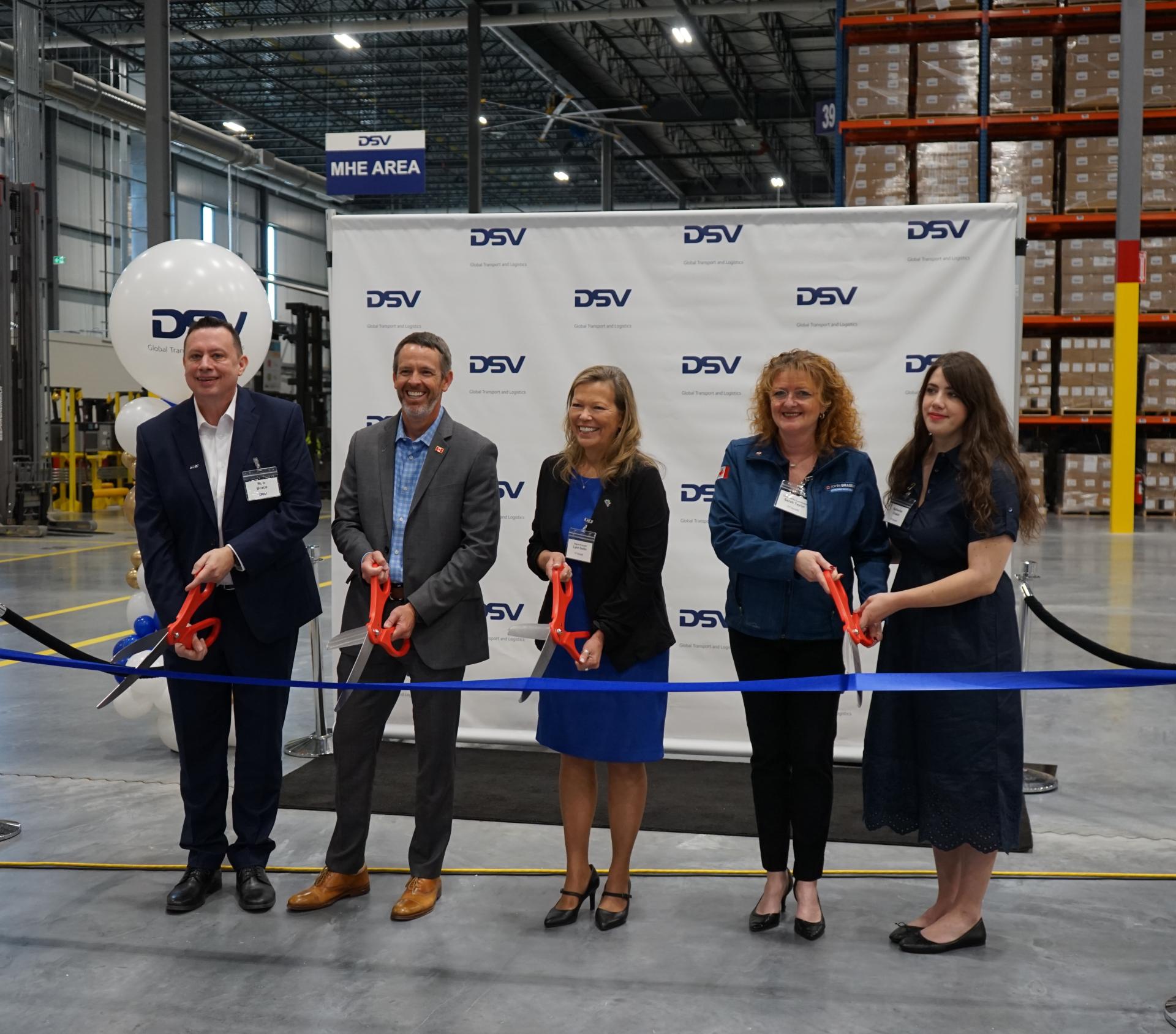 Mayor and DSV representatives cut the grand opening ribbon at new Innisfil DSV facility.