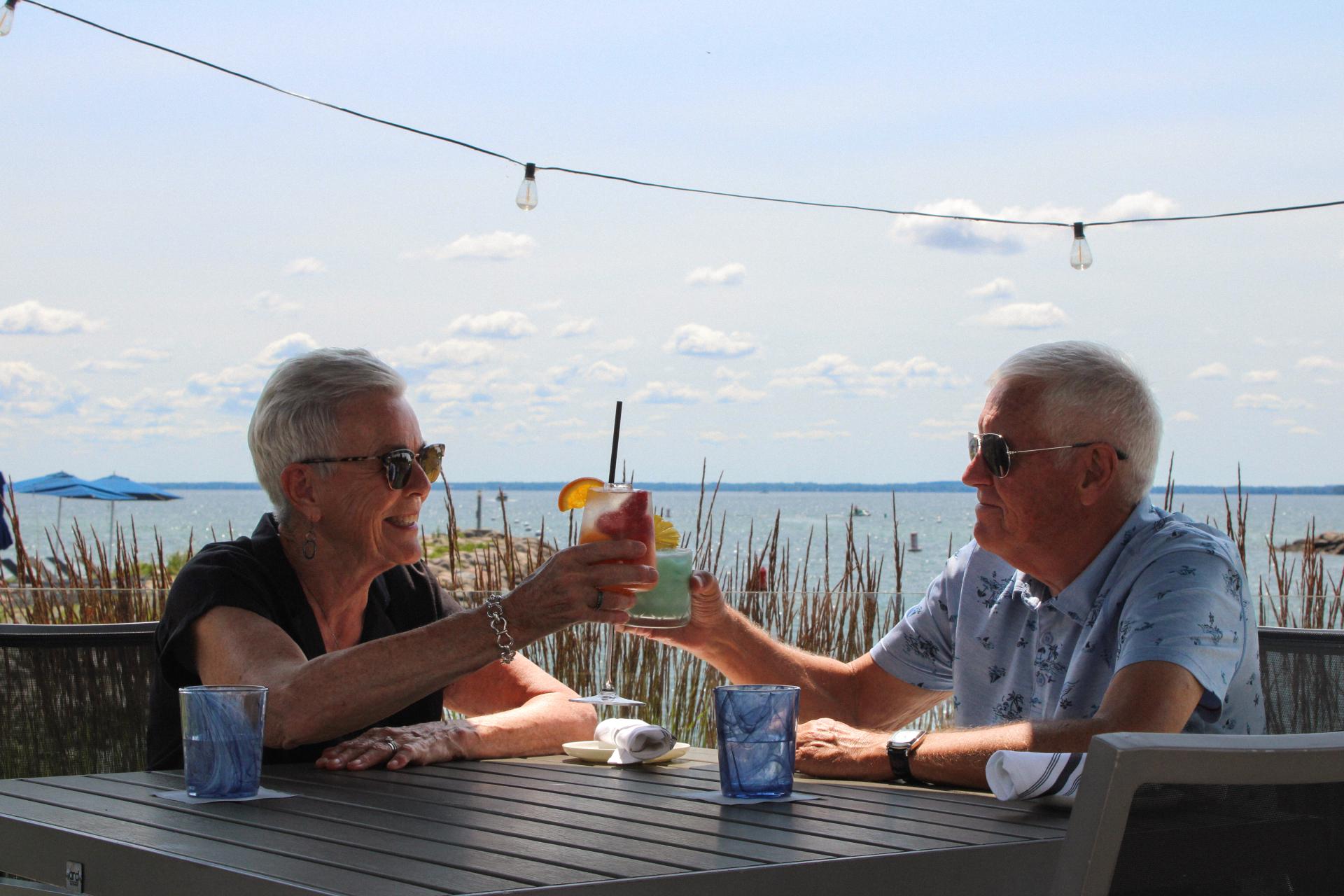 Couple enjoying a lakeside meal